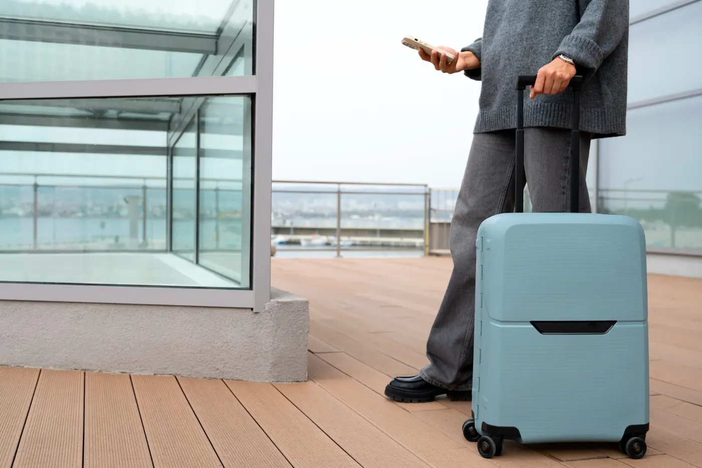 Traveler waiting on an airport terrace